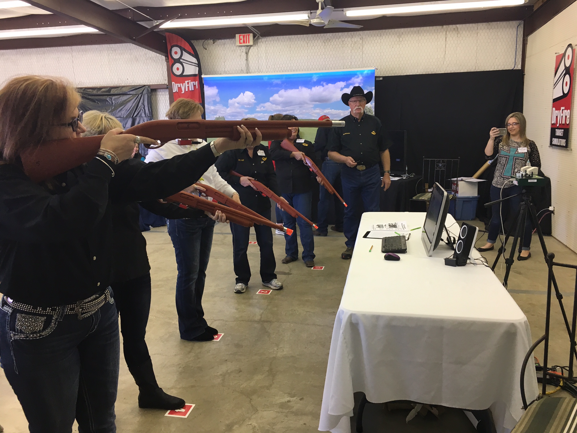 Trapshooters in a squad practicing indoor with DryFire target simulator